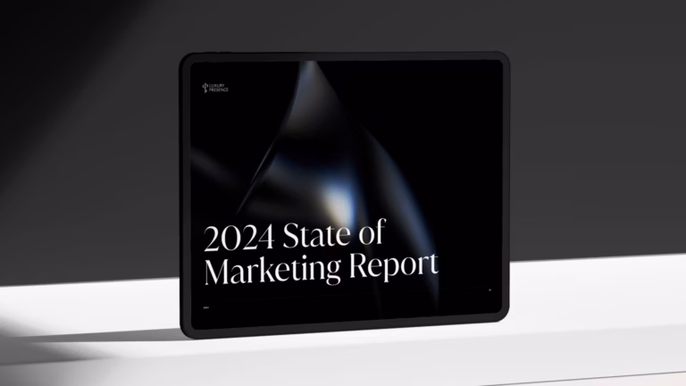 Tablet displaying the 2024 State of Real Estate Marketing report on a white table with a gray background
