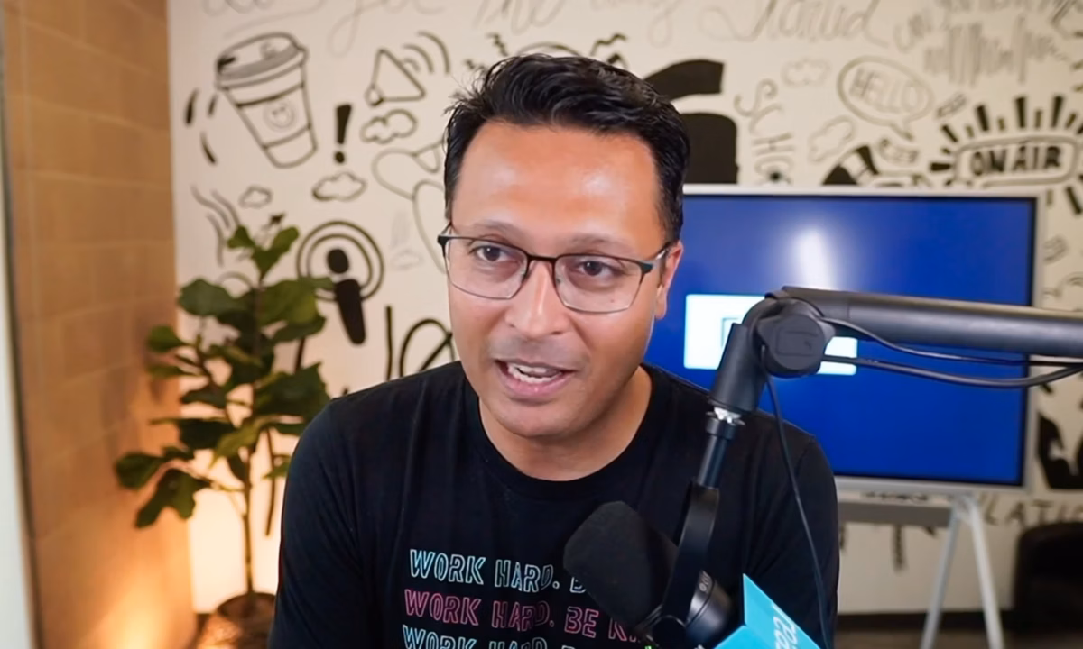 CEO of Real Sharran Srivatsaa sits in front of a mic being recorded for The Presence Podcast