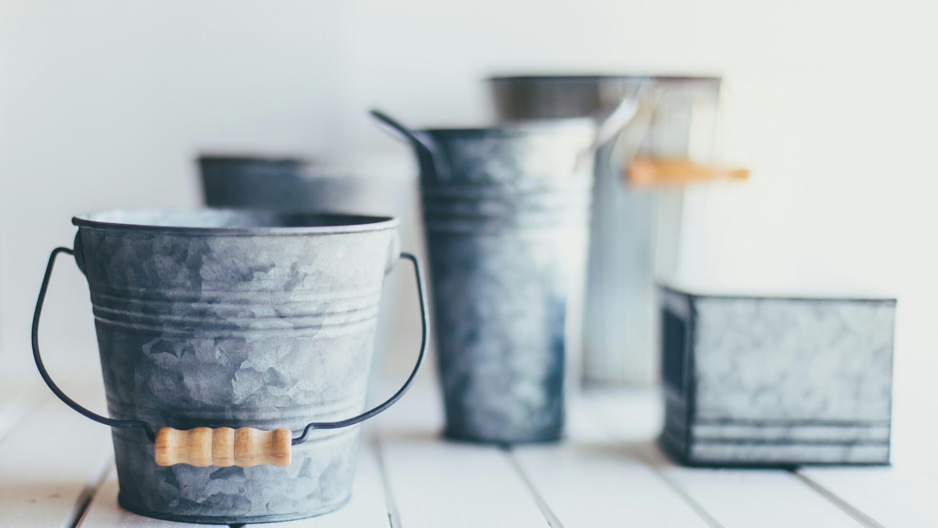 5 galvanized buckets of different shapes and sizes, representing audience segmentation techniques