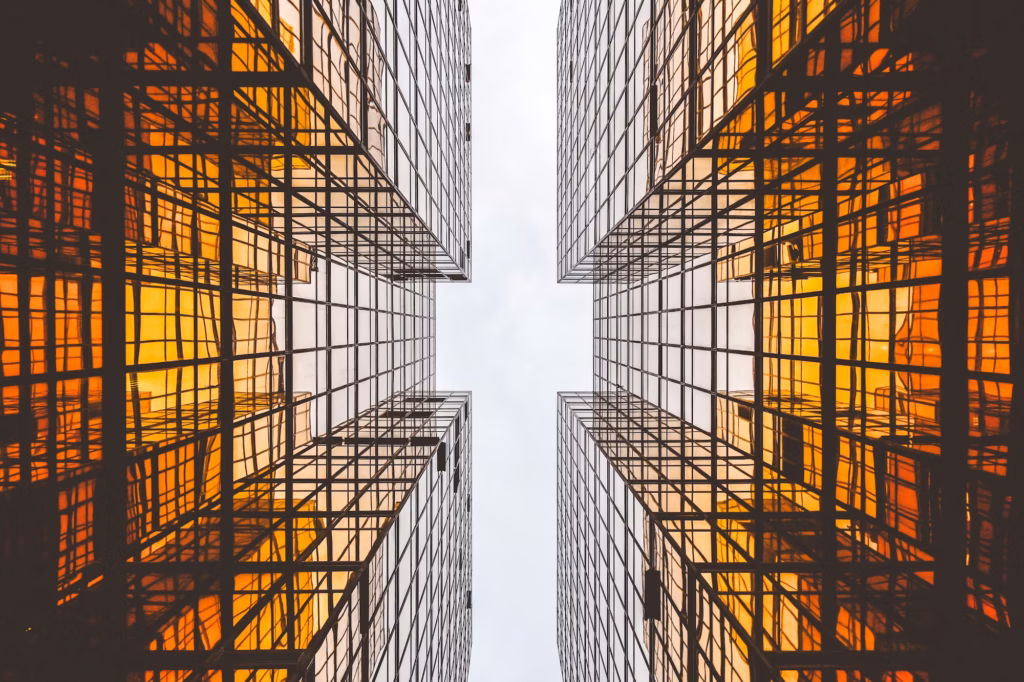 Two amber buildings tower overhead on opposite sides, representing the two sides of the Clear Cooperation Policy