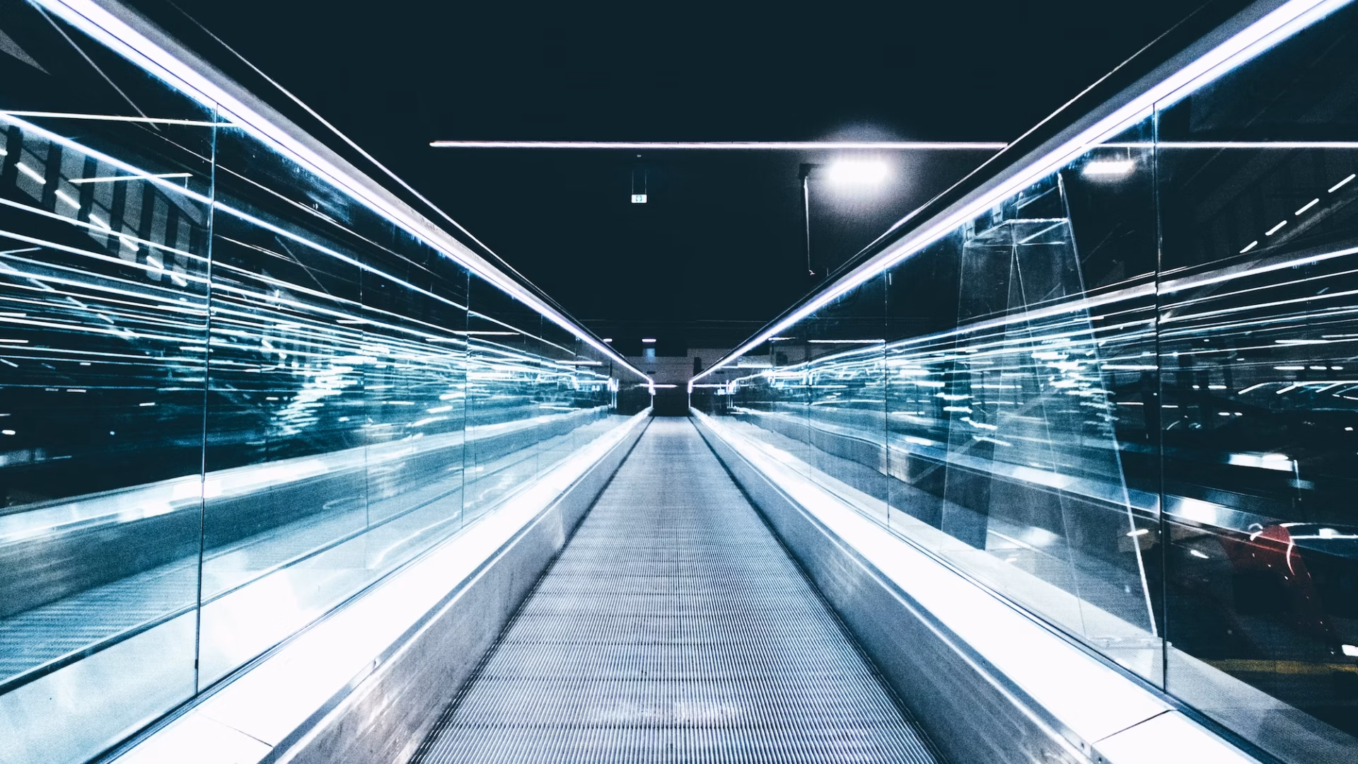 A moving walkway stretches ahead of the viewer, representing the future of the real estate industry during a time of change