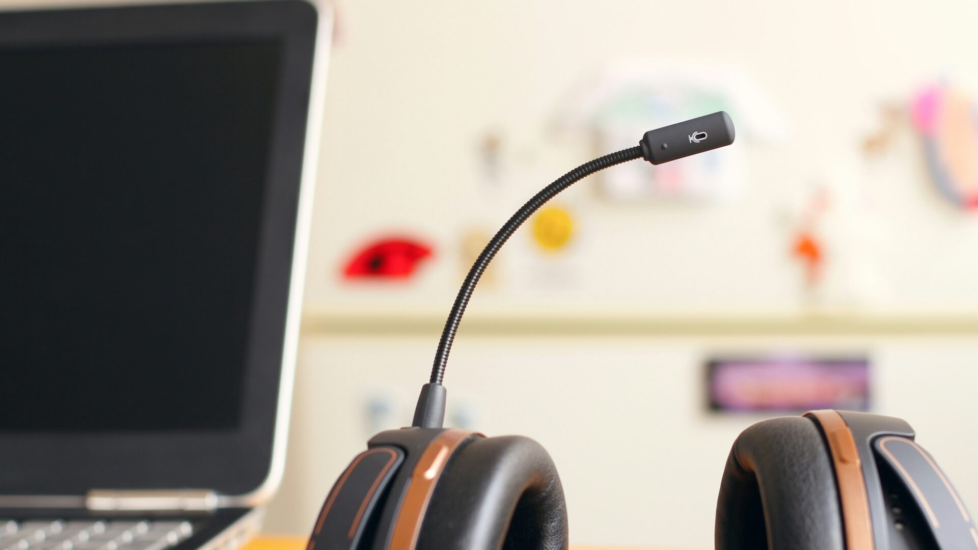 A headset with mic sits next to a laptop as a real estate professional ensures TCPA compliance in their lead generation strategies