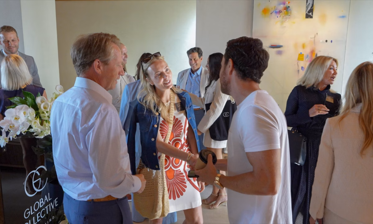 A group of luxury real estate agents at a networking event in 2024 with collective by luxury presence