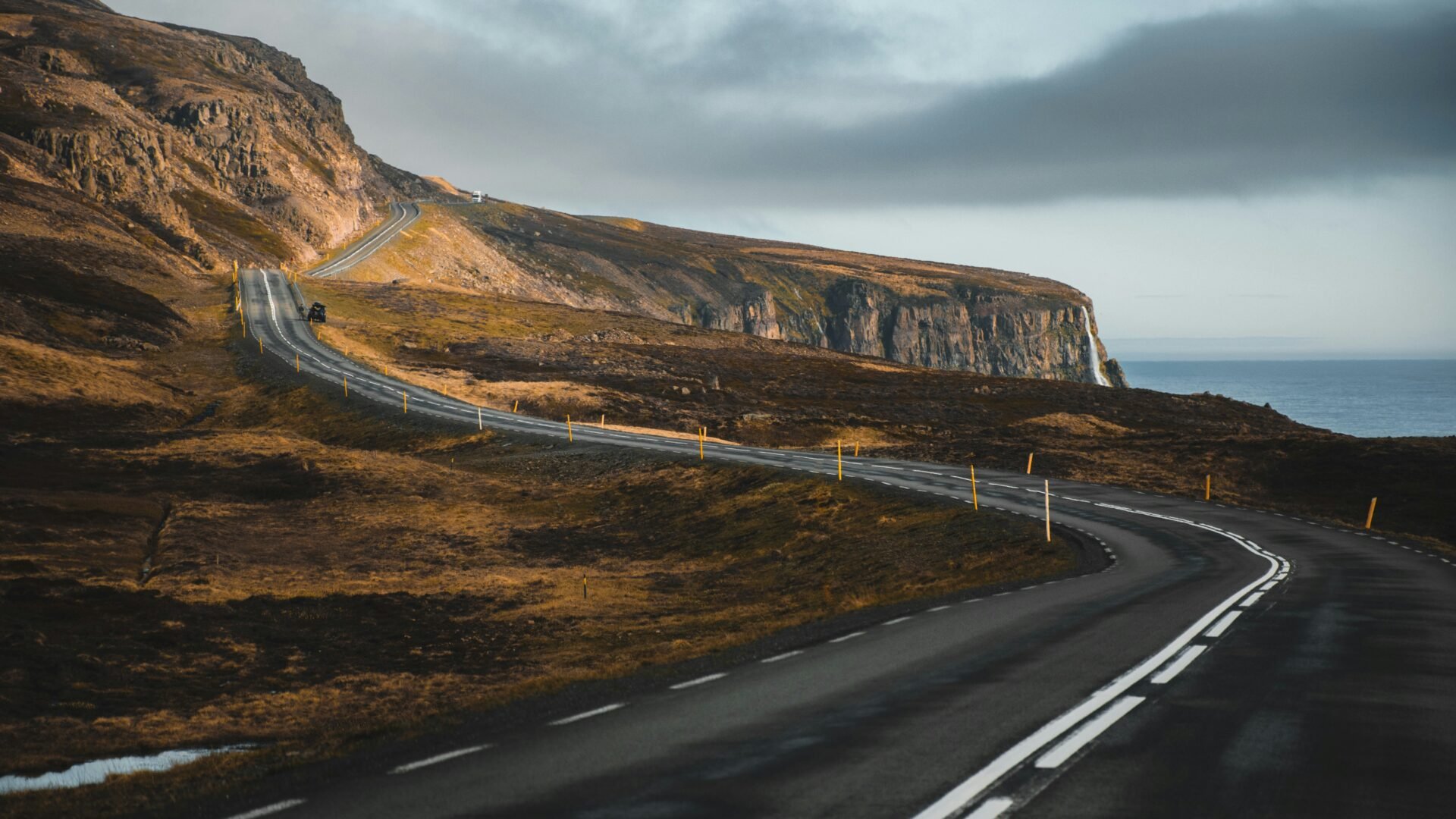 A winding road through a scenic landscape, symbolizing the real estate client journey