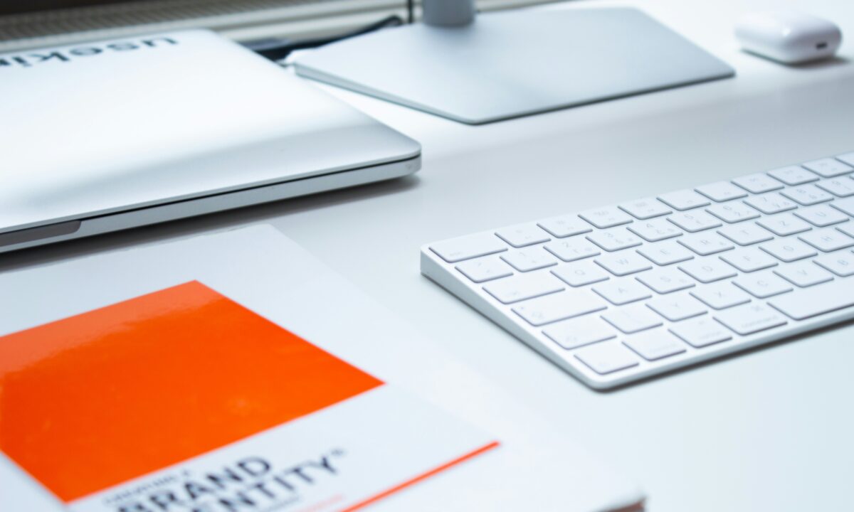 Tools needed for analyzing brand logos and market data to conduct a competitive brand analysis