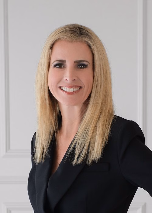 Headshot of Lauren Henss, marketing executive for FirstTeam real estate brokerage