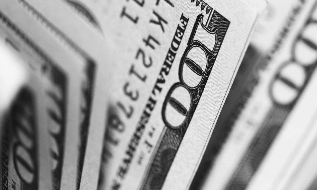 close up image of a hundred-dollar bills that illustrate a marketing ROI