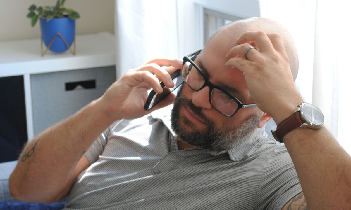 real estate agent is frustrated with a client while on the phone