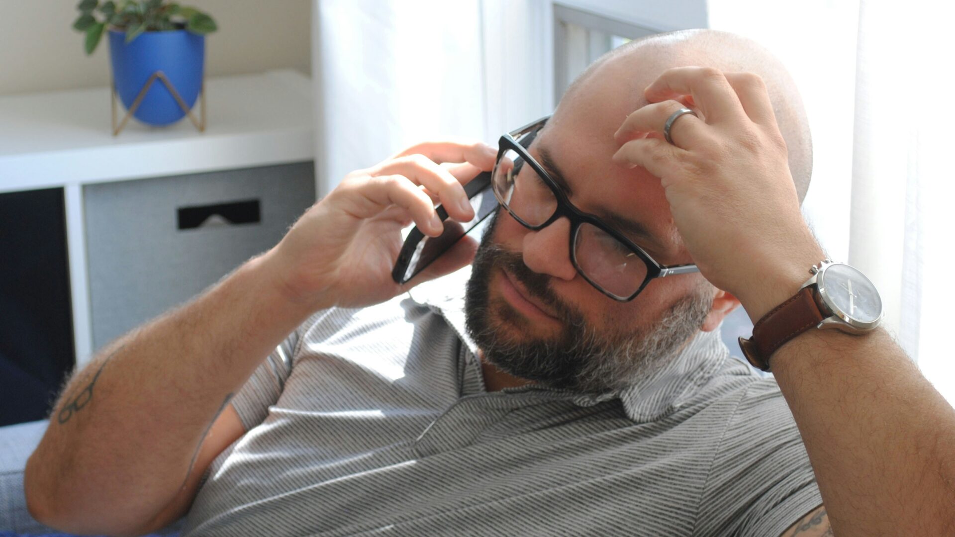 real estate agent is frustrated with a client while on the phone