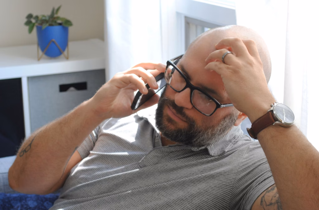 real estate agent is frustrated with a client while on the phone