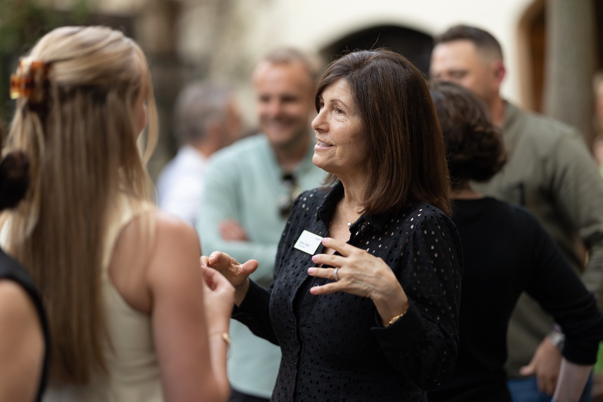 A group of professionals mingle at the collective mastermind 2025