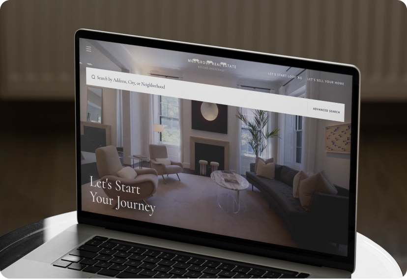 Laptop with the homepage for the MGS Group's real estate website